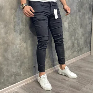 Men's slim fit stretchy skinny denim jeans in black shown on model