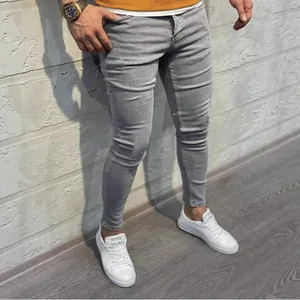 Premium men's light gray skinny stretch jeans featuring a modern slim fit design