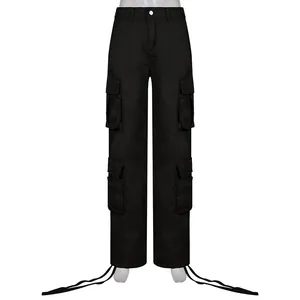 Detailed view of black streetwear cargo pants featuring multiple pockets and hem drawstrings.