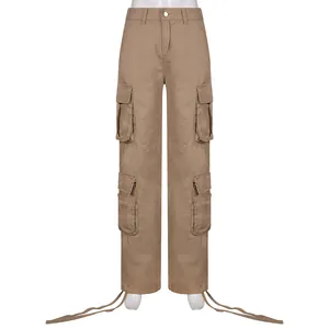 Close-up of brown multi-pocket cargo pants with adjustable hem straps for a street style look.