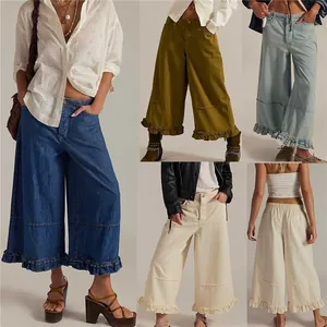 Stylish women's wide-leg cropped denim pants featuring a trendy ruffle hem and comfortable loose fit.