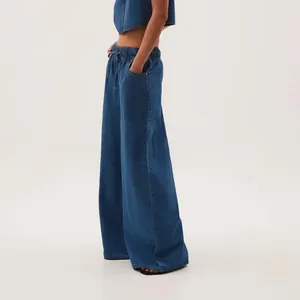 Side view of American vintage wide-leg blue denim jeans with elastic drawstring waist