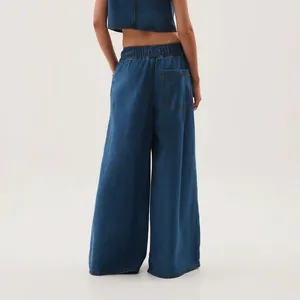 Detailed back view of vintage washed wide-leg denim jeans with elastic waist and pocket.