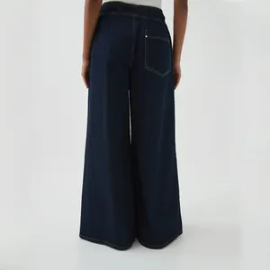 Back view of dark blue wide-leg jeans featuring an elastic waist and rear pocket