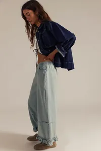 Stylish light blue wide leg cropped jeans with unique ruffle hem detail for women