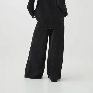 Back view of women's black wide-leg retro washed denim jeans with a relaxed straight-leg fit