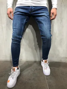 Detailed view of high-quality men's elastic slim-fit skinny denim jeans in dark blue