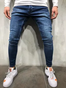 Close-up detail of slim fit stretch denim jeans for men in a classic washed blue finish