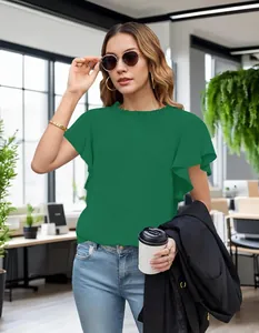 Green short sleeve blouse with ruffled neckline shown in a professional office setting.