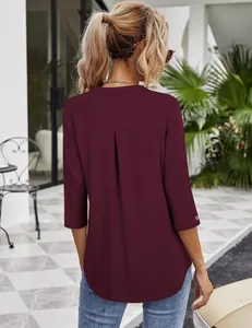 Back view of a burgundy women's casual blouse with 3/4 sleeves and elegant pleat detail
