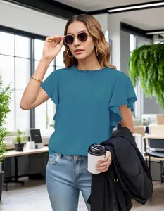 Close-up of elegant pleated short sleeve blouse in teal for business casual workwear