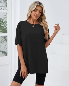 Close-up of a women's oversized black t-shirt with side slits and a round neckline