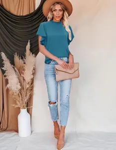 Elegant teal pleated mock neck blouse with ruffle sleeves detail shown on fashion model