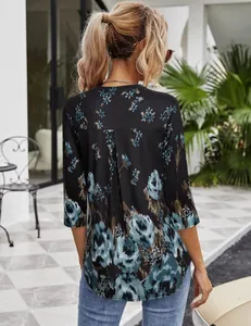 Back view of a women's casual floral print blouse with 3/4 sleeves and a relaxed fit.