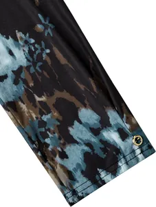 Macro detail shot of women's 3/4 sleeve shirt cuff with abstract blue floral print pattern