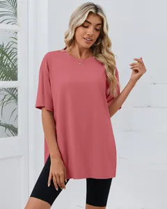 Close-up detail showing the loose fit and side slit design of this dusty rose T-shirt