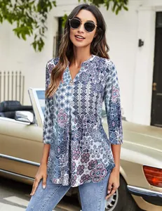 Women's floral V-neck tunic featuring a blue ethnic print and stylish seven-quarter sleeves.