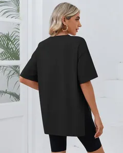 Back view of black oversized t-shirt for women featuring stylish side slits