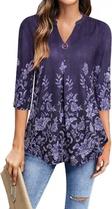 Detailed shot of women's elegant purple floral V-neck tunic blouse with 3/4 sleeves