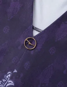 Close-up of V-neckline detail on purple patterned tunic top with gold ring