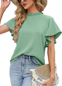 Detail view of green ruffled short sleeve blouse with elegant pleated mock neck design