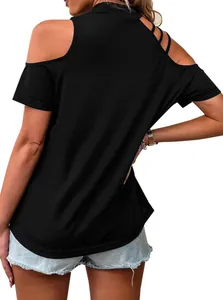 Rear view of black cold shoulder t-shirt showing multi-strap detail and loose fit