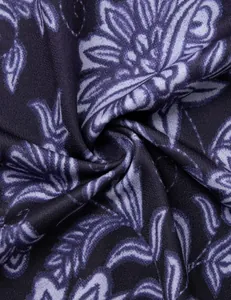 Detailed macro view of dark purple floral print fabric for casual women's V-neck tunic shirt