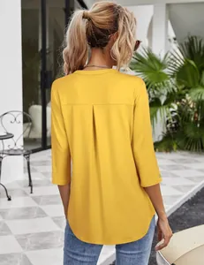 Back view of mustard yellow women's V-neck blouse featuring 3/4 sleeves and pleat detail