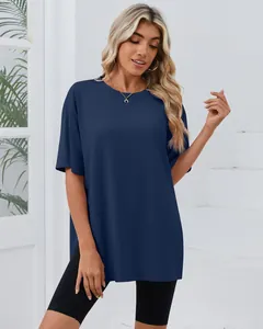 Full view of navy blue oversized t-shirt with side slits and crew neck on a model.