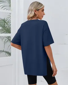 Back view of women's oversized navy blue short sleeve T-shirt with side split detail