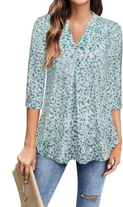 Detailed view of women's 3/4 sleeve V-neck floral blouse with metal ring detail