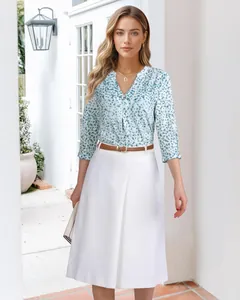 Elegant women's floral V-neck blouse with 3/4 sleeves and matching white skirt outfit