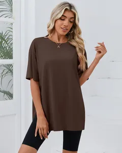Full view of women's loose brown short sleeve T-shirt with side slits and crew neck
