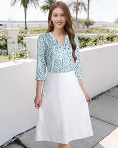 Detail view of women's floral V-neck shirt with 3/4 sleeves and metal ring