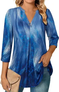 Detail view of women's 3/4 sleeve V-neck tunic featuring a blue abstract wave print