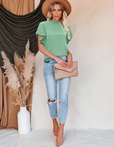 Elegant green pleated mock neck blouse with ruffle sleeves and casual styling.