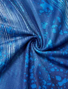 Detailed macro shot showing the soft texture of blue abstract print tunic fabric