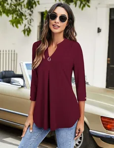 Elegant women's burgundy three-quarter sleeve tunic shirt featuring a pleated V-neck detail