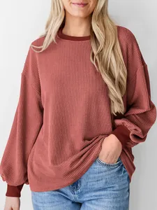 Casual losvallende geribbelde top met lange mouwen in terracotta met verlaagde schouders