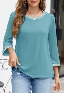 Detailed view of blue knitted top featuring striped ribbed crewneck and sleeve cuffs.
