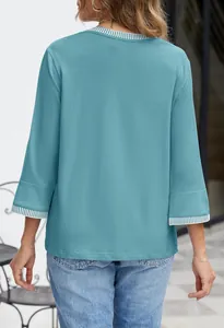 Back view of teal knitted top featuring striped ribbed crew neck and 3/4 sleeves