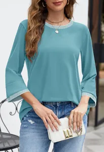 Detail view of women's stylish aqua long sleeve top featuring striped rib crew neck