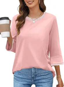 Close-up detail of a women's pink crewneck top with contrast striped collar and cuffs