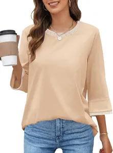 Detail view of women's apricot knit top featuring striped rib round neck and cuffs