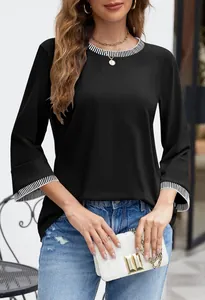 Elegant black knit top with a striped ribbed crewneck and flared sleeves design detail.