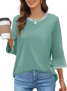 Detail view of women's mint green knit top with contrast striped trim on neck and cuffs
