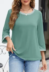 Detail view of the striped contrast rib crewneck and cuffs on a green knit top.
