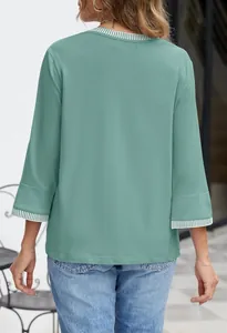 Back view of a green round-neck knit top with white striped ribbed cuffs detail