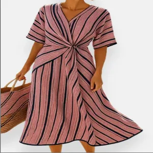 Detail of V-neck striped dress with waist twist detail and short sleeves
