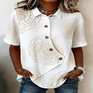 A detailed view of this women's white casual shirt featuring an irregular hem and spiral print